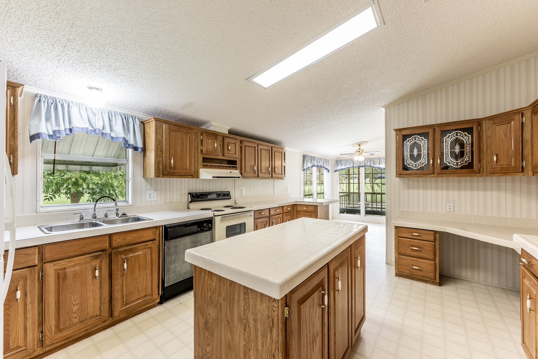 227 Cutter Drive Trinity, TX 75862 - Photo 11 of 39 a kitchen with a stove sink and cabinets
