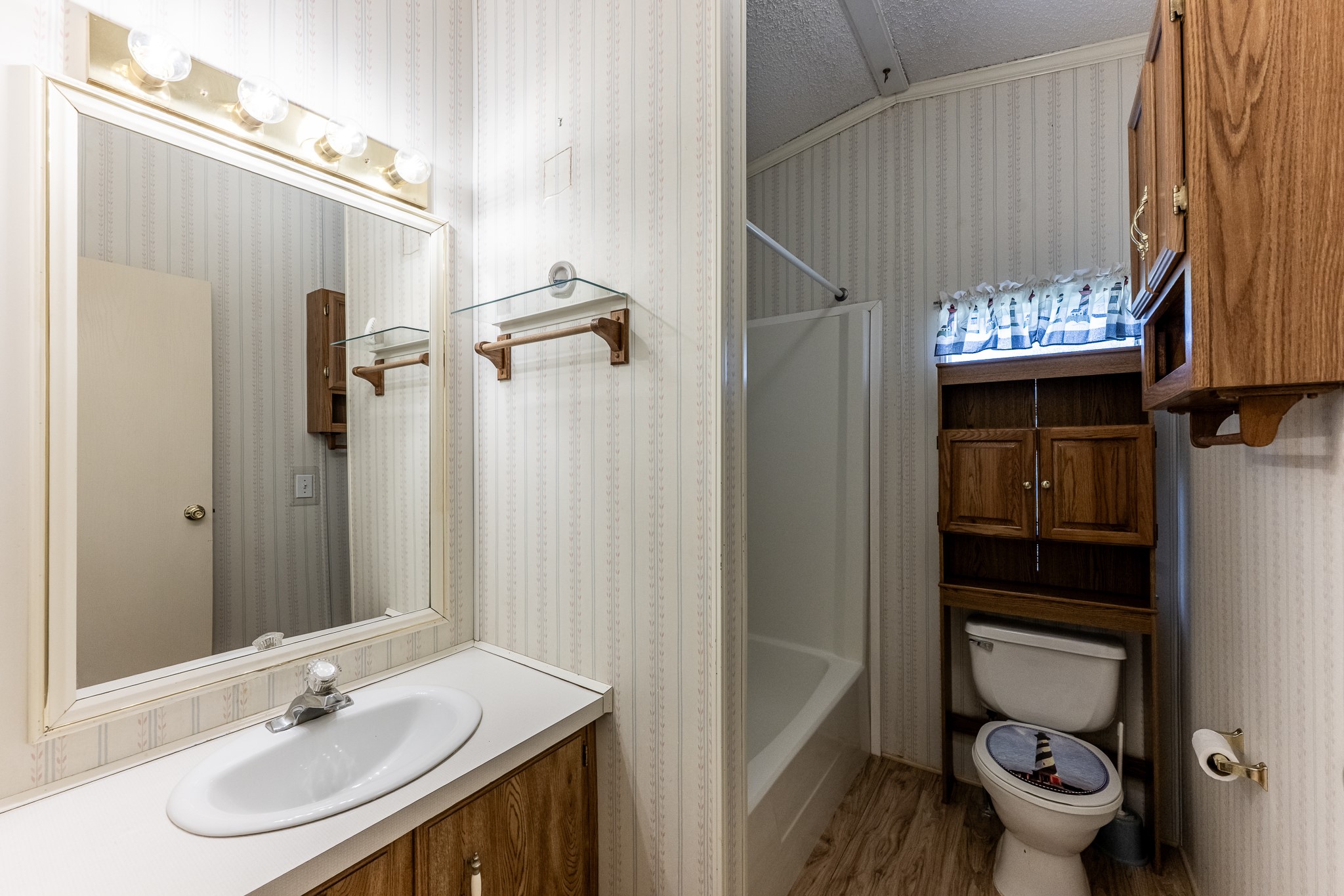 227 Cutter Drive Trinity, TX 75862 - Photo 22 of 39 a bathroom with a sink a toilet and shower