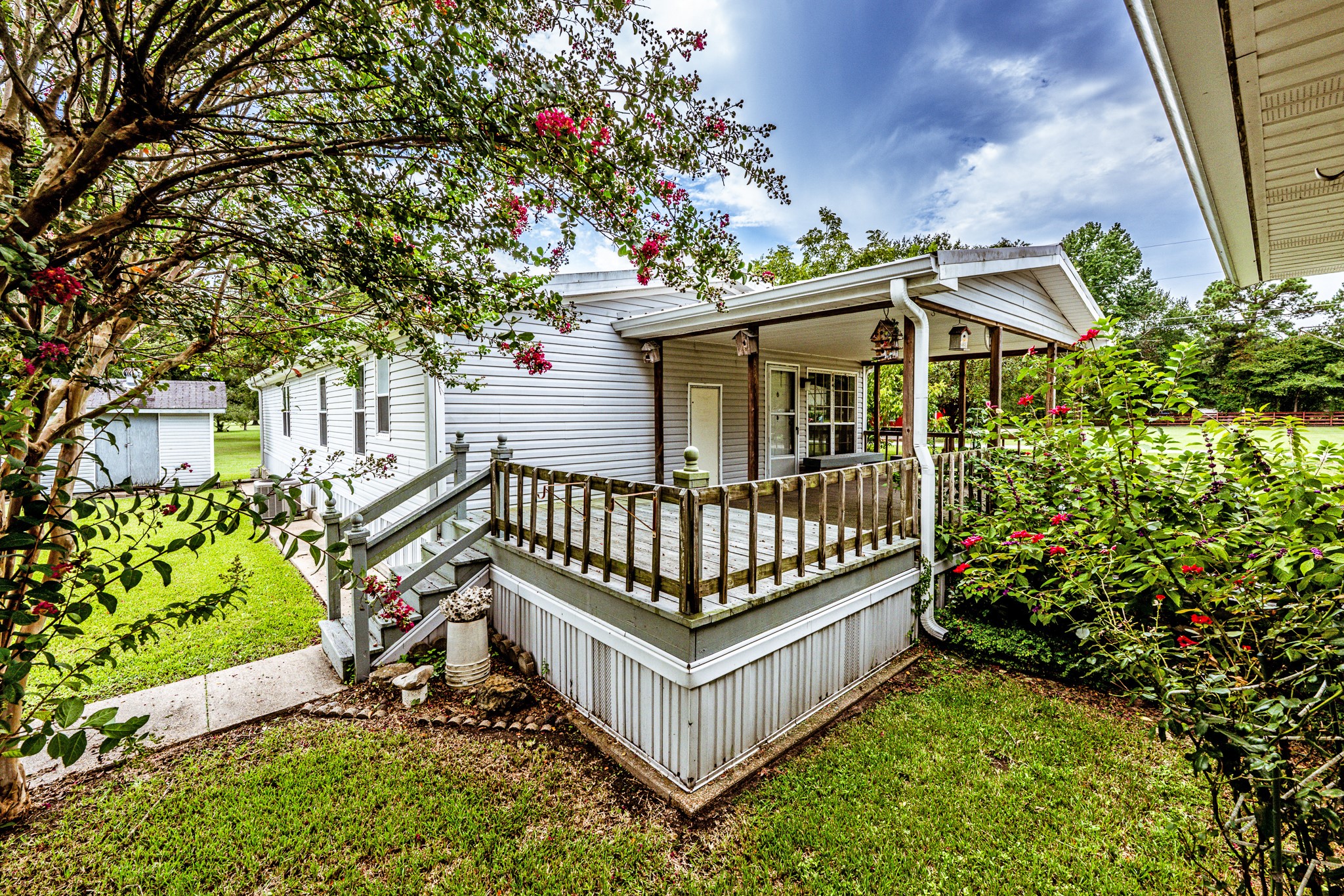 227 Cutter Drive Trinity, TX 75862 - Photo 24 of 39 a view of a porch with a bench