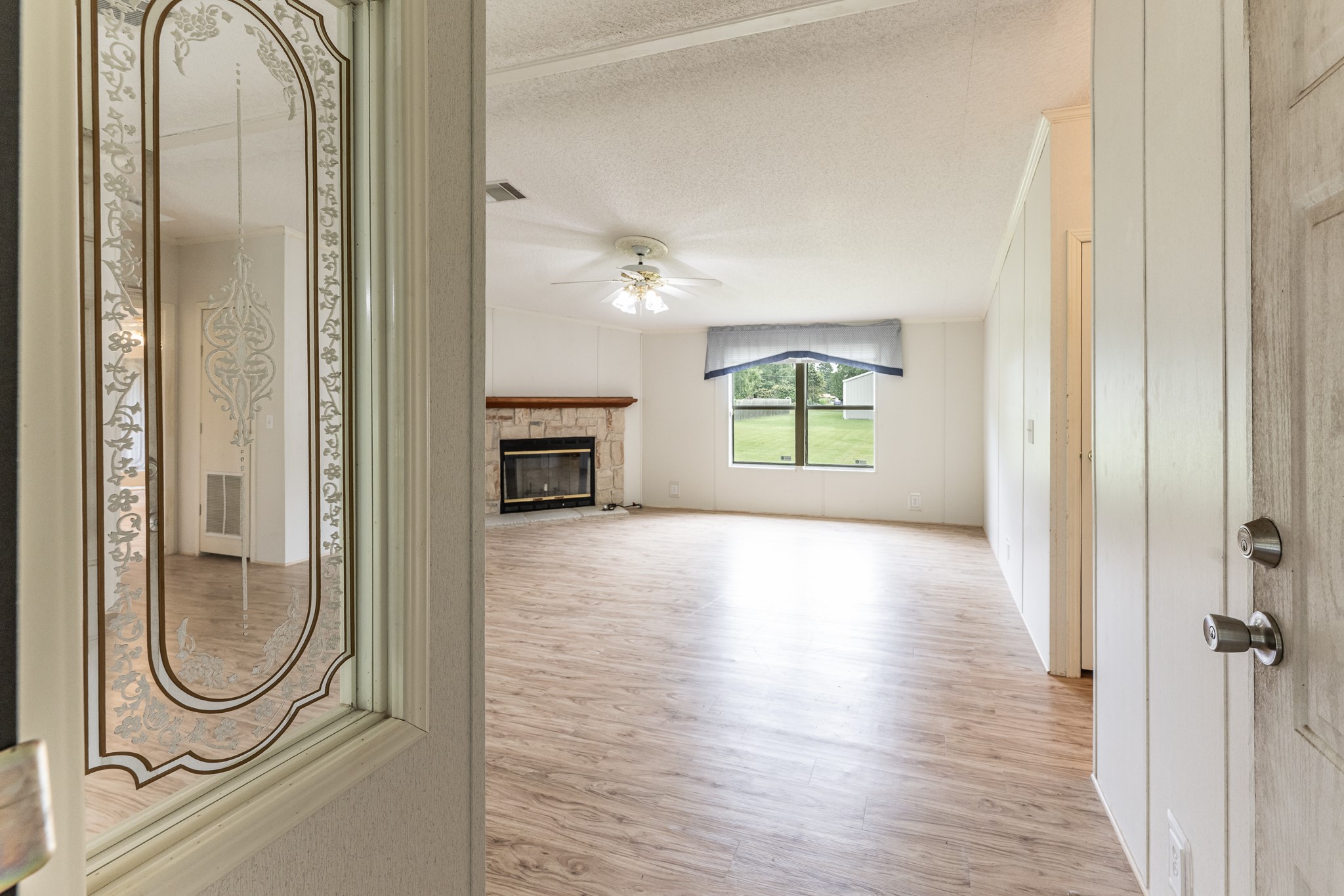 227 Cutter Drive Trinity, TX 75862 - Photo 6 of 39 a view of a livingroom with wooden floor and a window