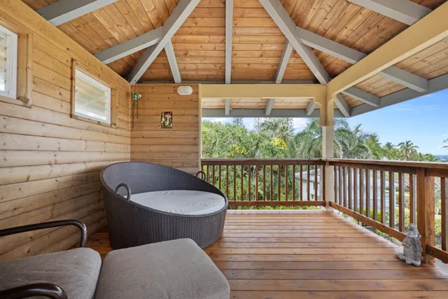 a view of a balcony with chairs