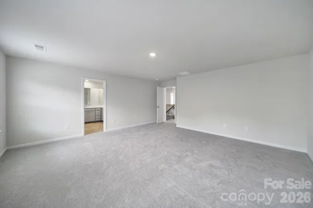 a bathroom with a double vanity sink and mirror