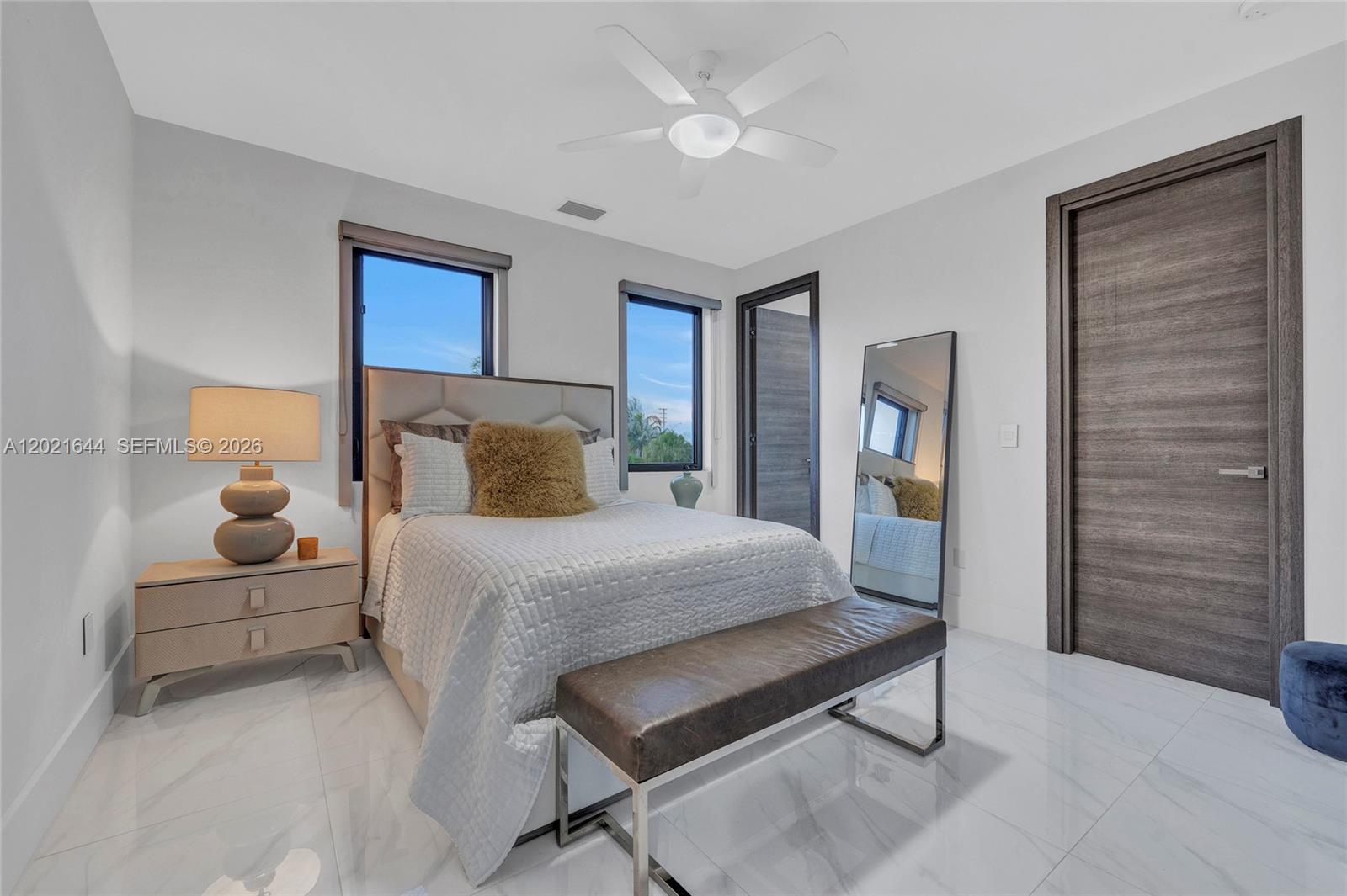 7800 Southwest 9th Terrace Miami, FL 33144 - Photo 51 of 64 a bedroom with a bed and a chandelier