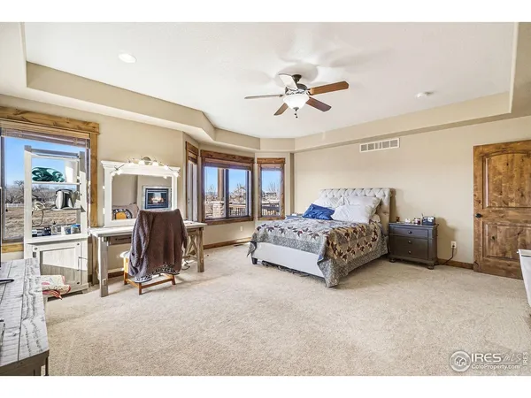 a living room with furniture gym equipment and a view of bedroom