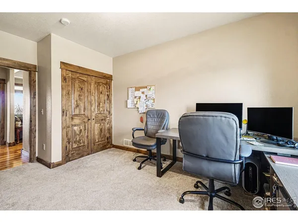 a workspace with furniture and a window
