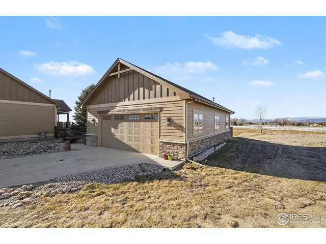 a view of a terrace with chairs and a ocean view