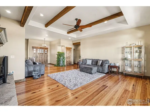 a living room with couch and wooden floor