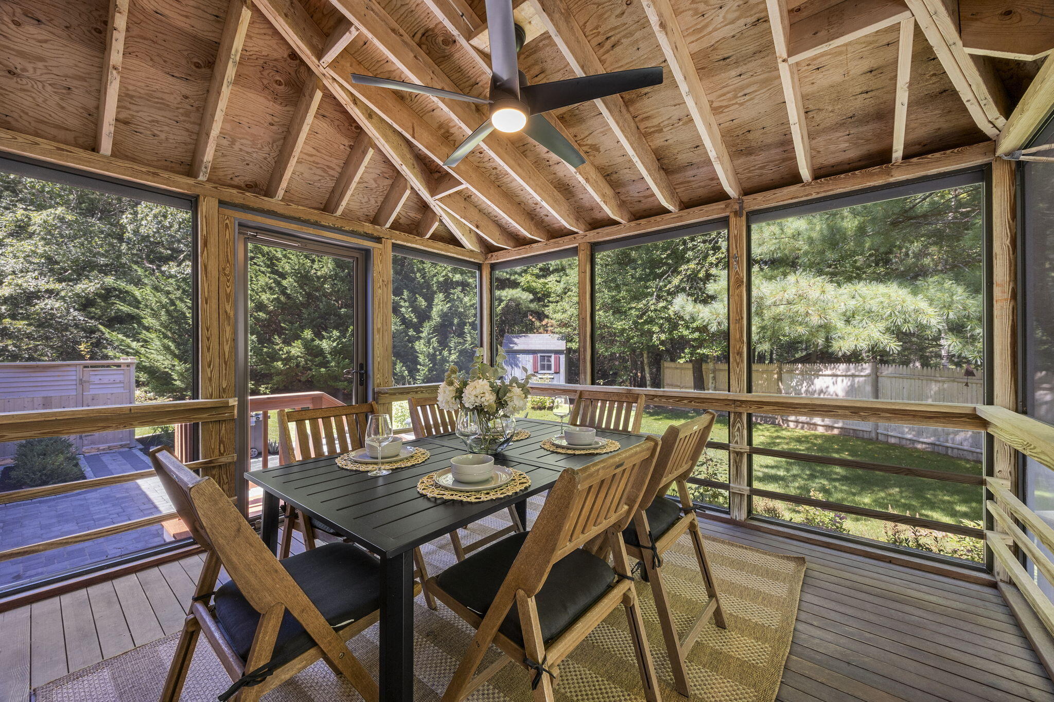 6 Sturbridge Drive Orleans, MA 02653 - Photo 12 of 40 a view of a patio with a table chairs and wooden floor