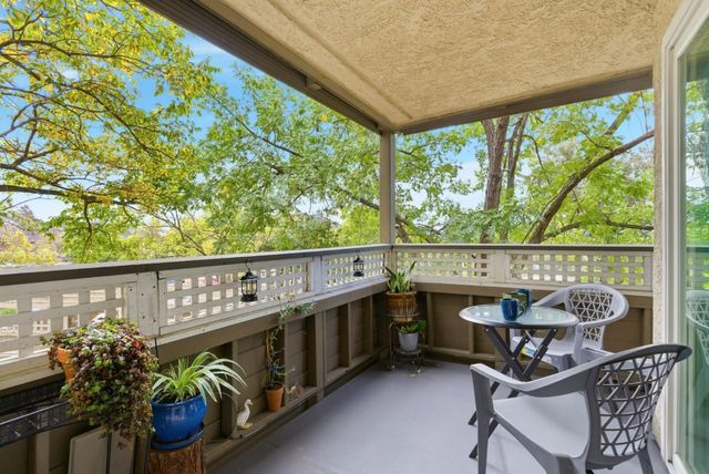 a view of a chairs and table in patio