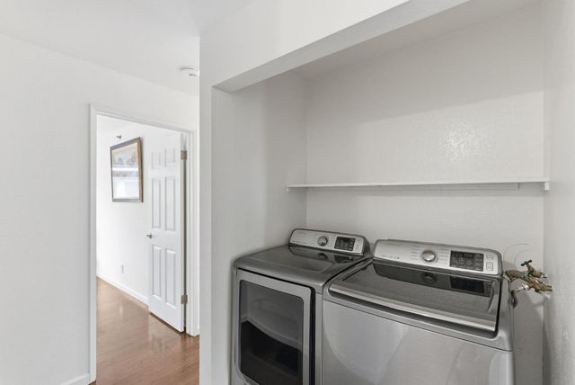 a view of storage and utility room with washer and dryer