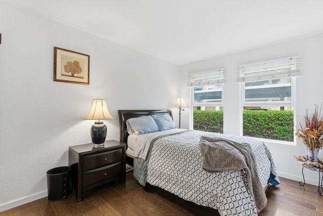 a bedroom with bed and window