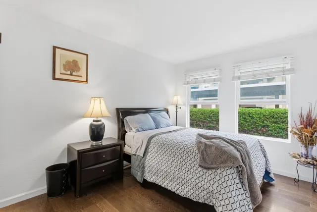 a bedroom with bed and window