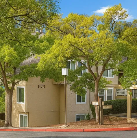 a view of a house with a tree