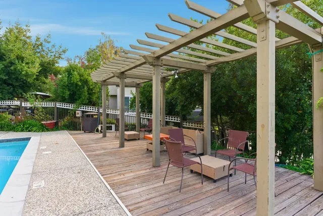 a view of sitting area with furniture and wooden floor