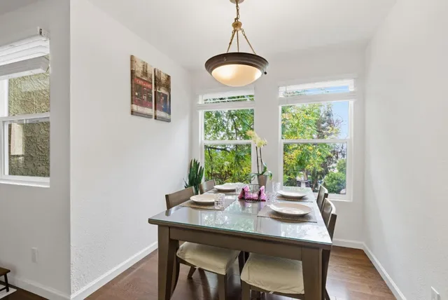 a view of a dining room with furniture window and wooden floor