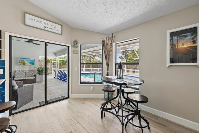 a view of a livingroom with furniture and hardwood floor