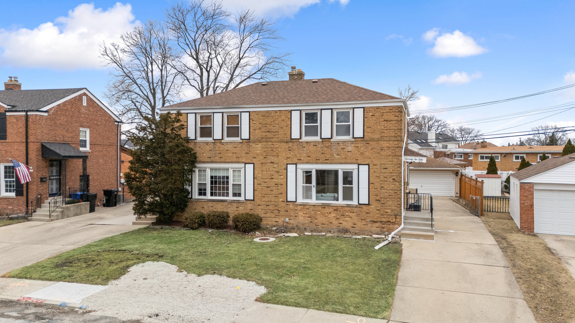 7250 West Rascher Avenue Chicago, IL 60656 - Photo 19 of 22 a front view of a house with a yard