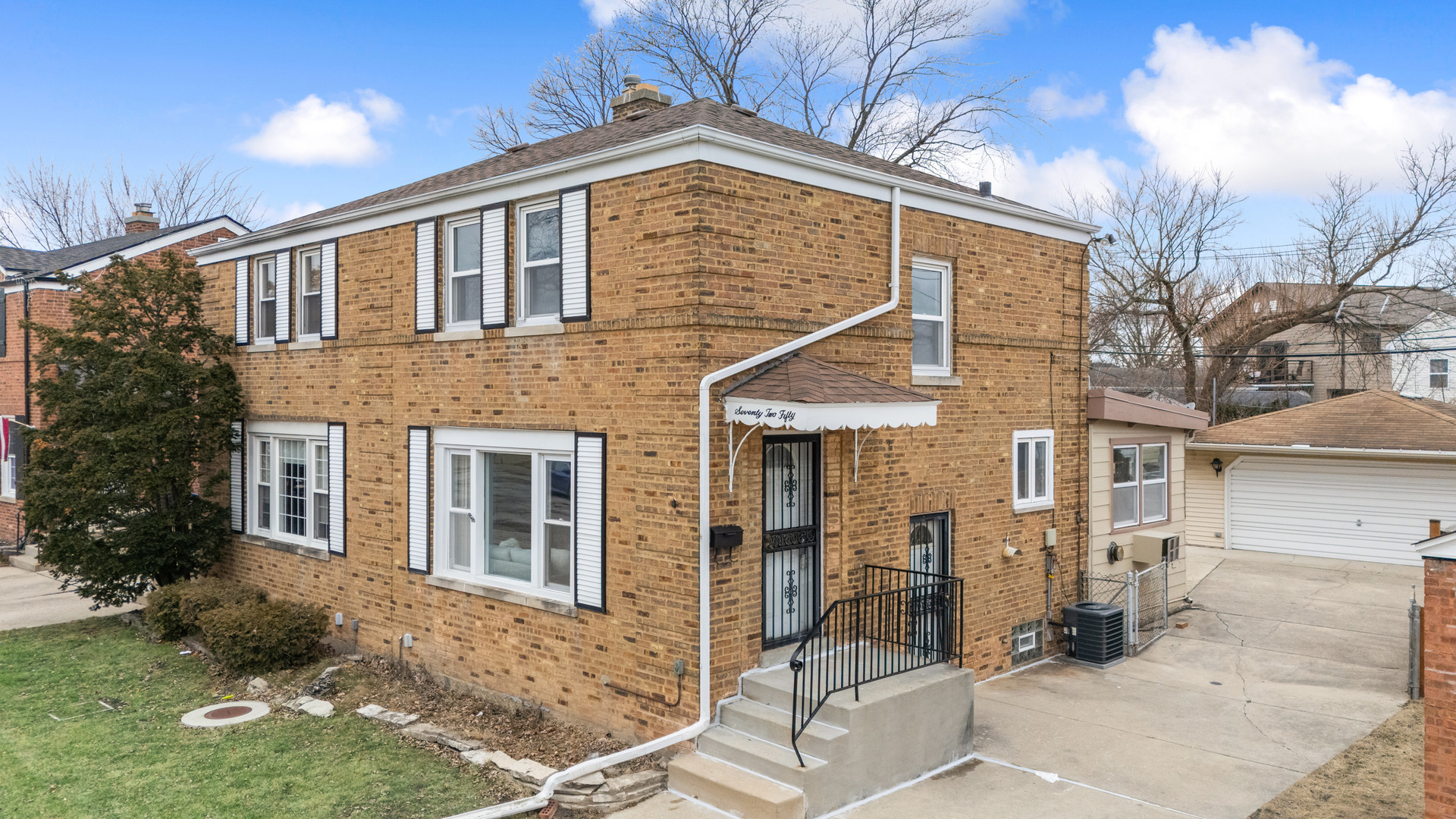 7250 West Rascher Avenue Chicago, IL 60656 - Photo 2 of 22 a view of a house with a yard