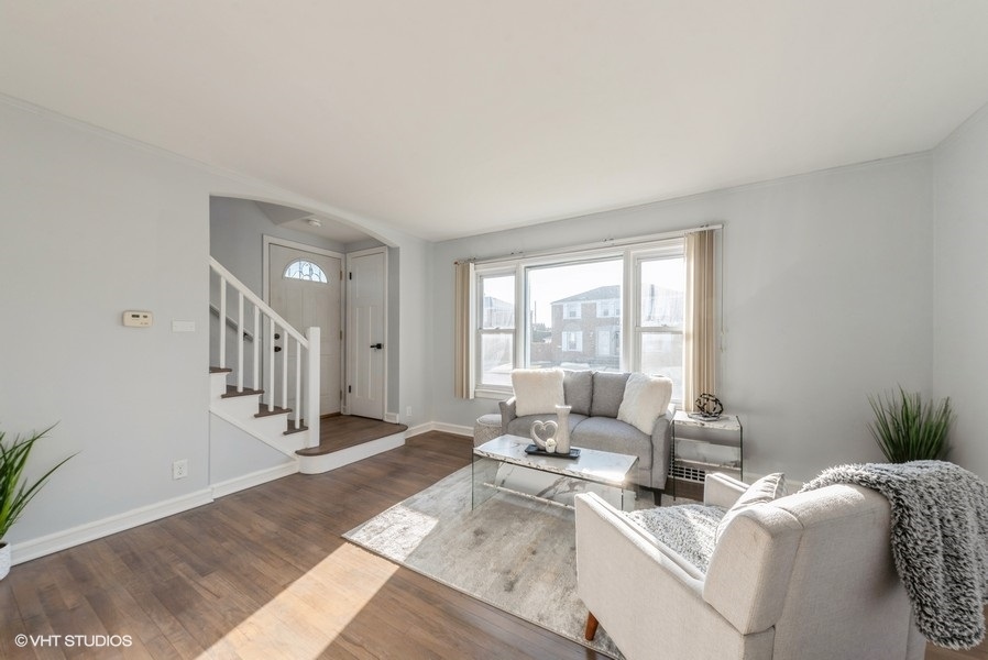 7250 West Rascher Avenue Chicago, IL 60656 - Photo 3 of 22 a living room with furniture and a large window