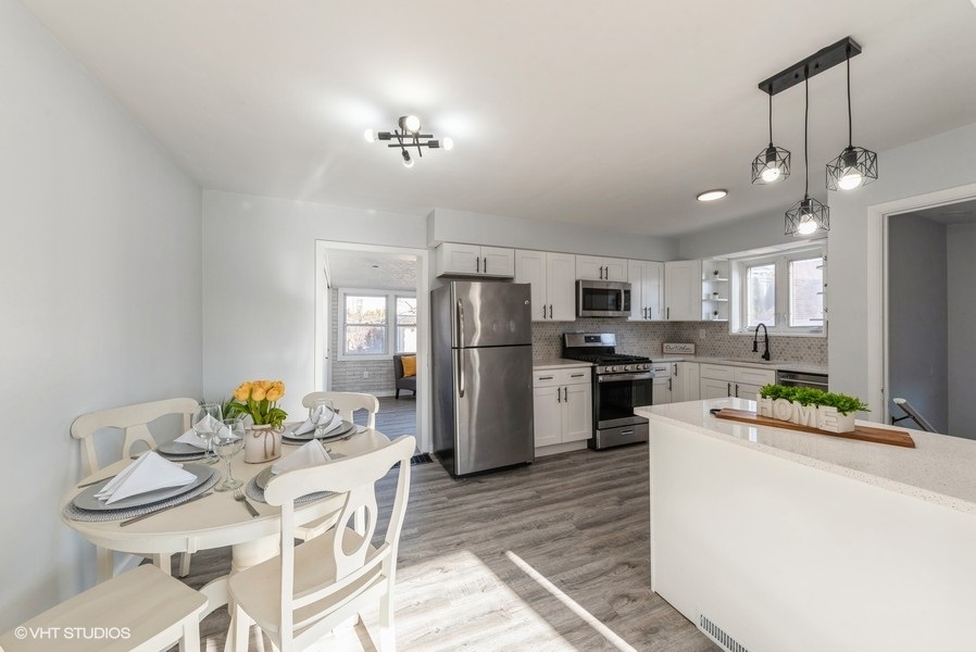 7250 West Rascher Avenue Chicago, IL 60656 - Photo 8 of 22 a kitchen with refrigerator and cabinets