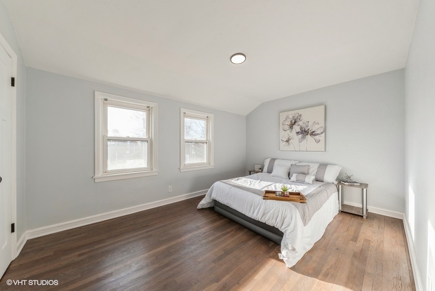 7250 West Rascher Avenue Chicago, IL 60656 - Photo 9 of 22 a bedroom with a bed and a window