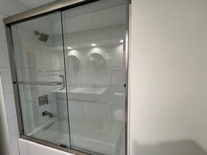 556 Barton Avenue, Unit 2 Evanston, IL 60202 - Photo 16 of 19 a bathroom with a glass shower door