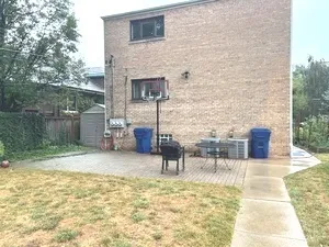 a view of a bench in the backyard
