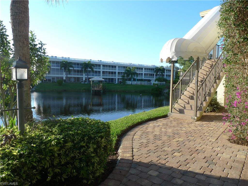 3115 Riviera Drive Naples, FL 34103 - Photo 1 of 15 Separate Entrance Stairwell Somerset at the Moorings - 3115 Riviera Drive #204