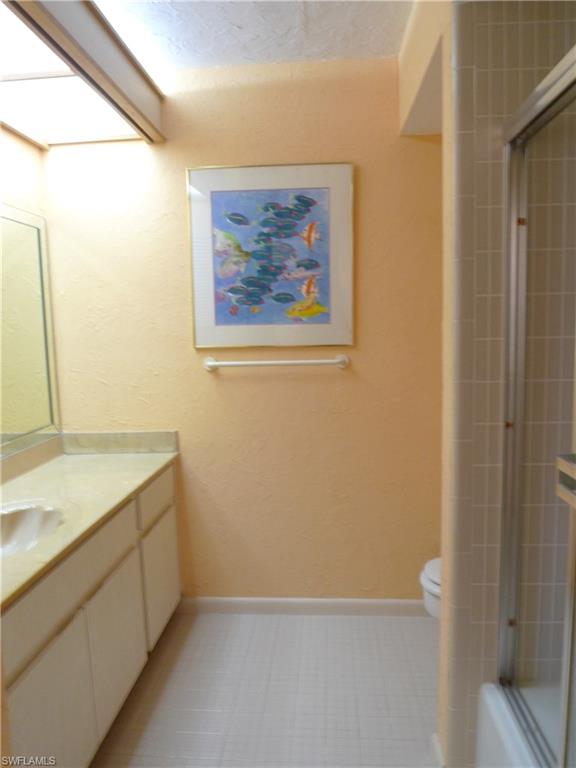 3115 Riviera Drive Naples, FL 34103 - Photo 12 of 15 SECOND BATH WITH TUB/SHOWER