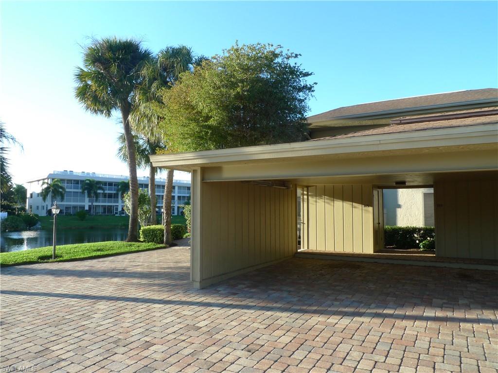 3115 Riviera Drive Naples, FL 34103 - Photo 13 of 15 ONE ASSIGNED CARPORT SPACE WITH STORAGE UNIT