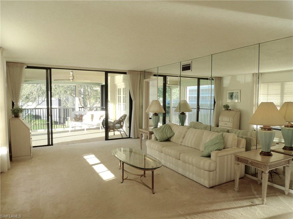3115 Riviera Drive Naples, FL 34103 - Photo 4 of 15 Living room view to north side lanai