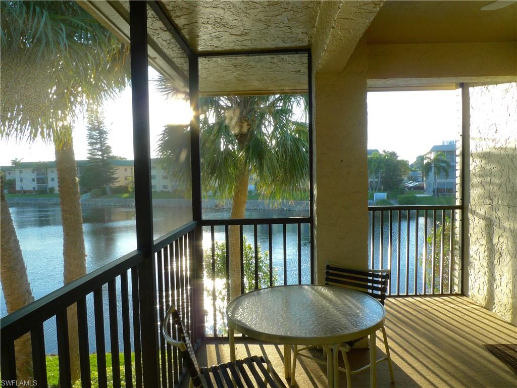 3115 Riviera Drive Naples, FL 34103 - Photo 7 of 15 South side lanai entrance from kitchen