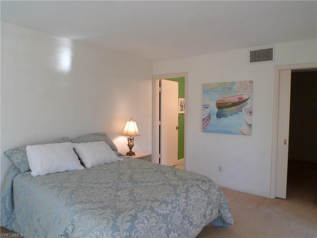 3115 Riviera Drive Naples, FL 34103 - Photo 8 of 15 MASTER BEDROOM WITH WALK-IN CLOSET