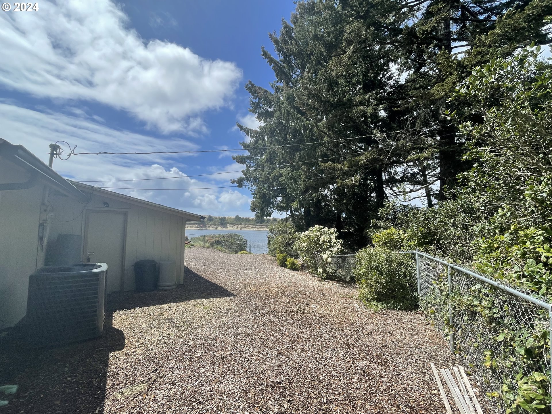 100 Rhododendron Drive Florence, OR 97439 - Photo 37 of 47 a view of a backyard
