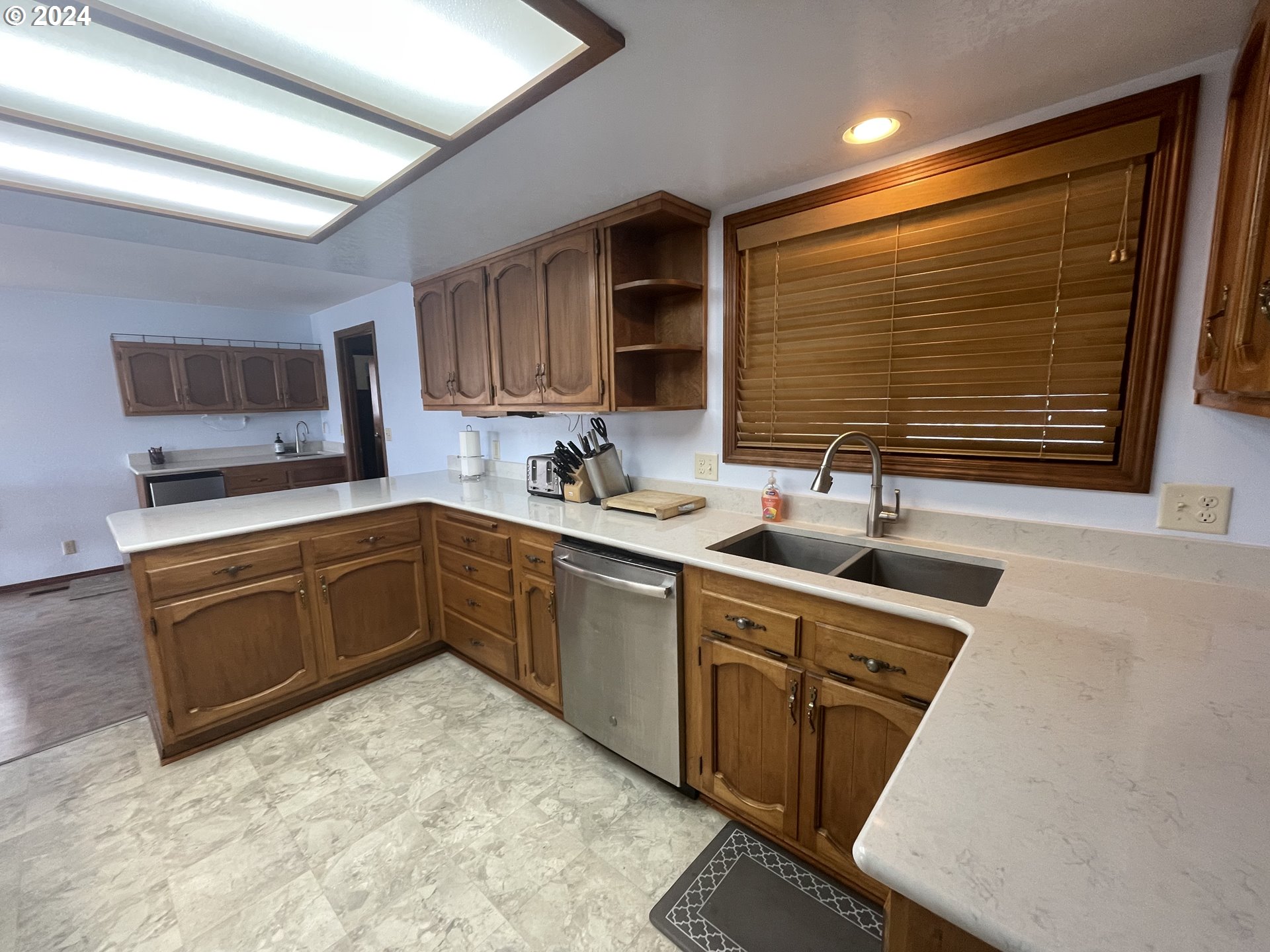 100 Rhododendron Drive Florence, OR 97439 - Photo 5 of 47 a kitchen with a sink stove and microwave