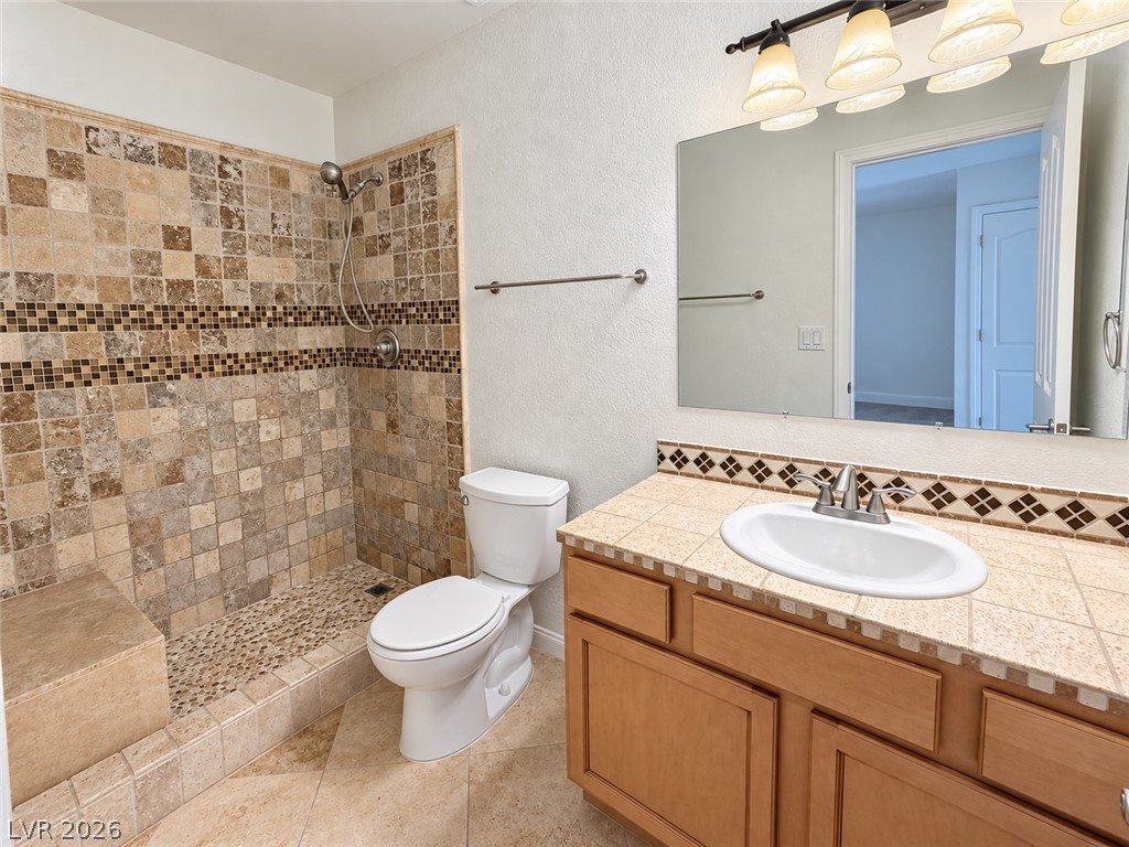 43 Bayridge Road Henderson, NV 89074 - Photo 47 of 47 A tiled walk-in shower highlights this functional bathroom spaces.