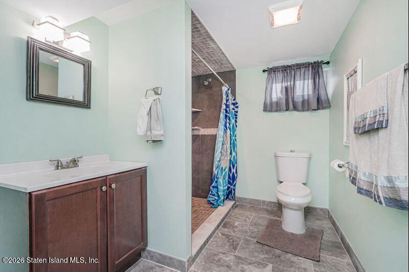 11 North Rhett Avenue Staten Island, NY 10308 - Photo 14 of 20 a bathroom with a sink toilet and shower