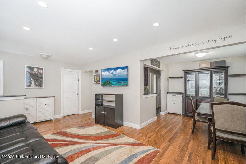 11 North Rhett Avenue Staten Island, NY 10308 - Photo 3 of 20 a spacious bedroom with a bed and wooden floor