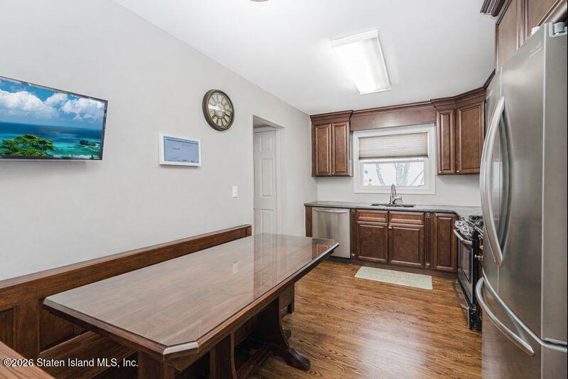 11 North Rhett Avenue Staten Island, NY 10308 - Photo 5 of 20 a kitchen with stainless steel appliances granite countertop a refrigerator sink and stove