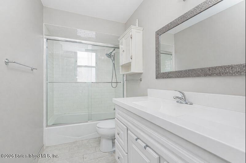 11 North Rhett Avenue Staten Island, NY 10308 - Photo 7 of 20 a bathroom with a sink a toilet and shower