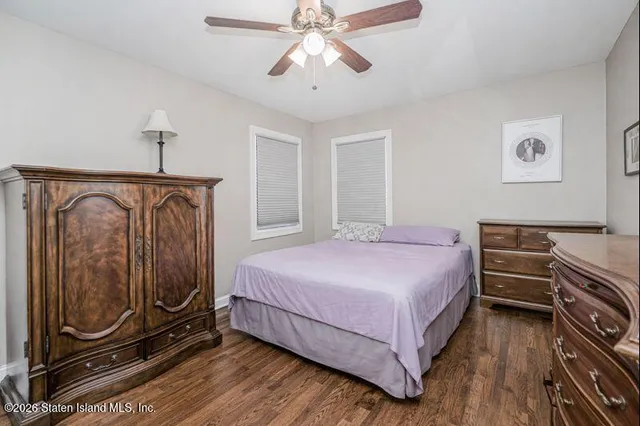 a bedroom with a bed and dresser