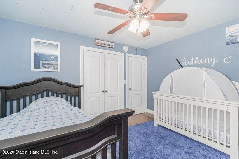 11 North Rhett Avenue Staten Island, NY 10308 - Photo 10 of 20 a view of a room with furniture and a chandelier fan