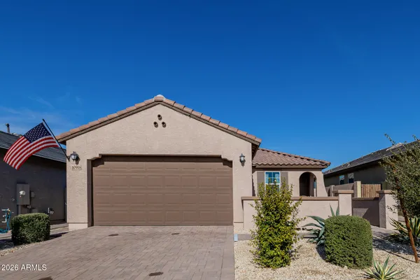 a front view of a house with garage