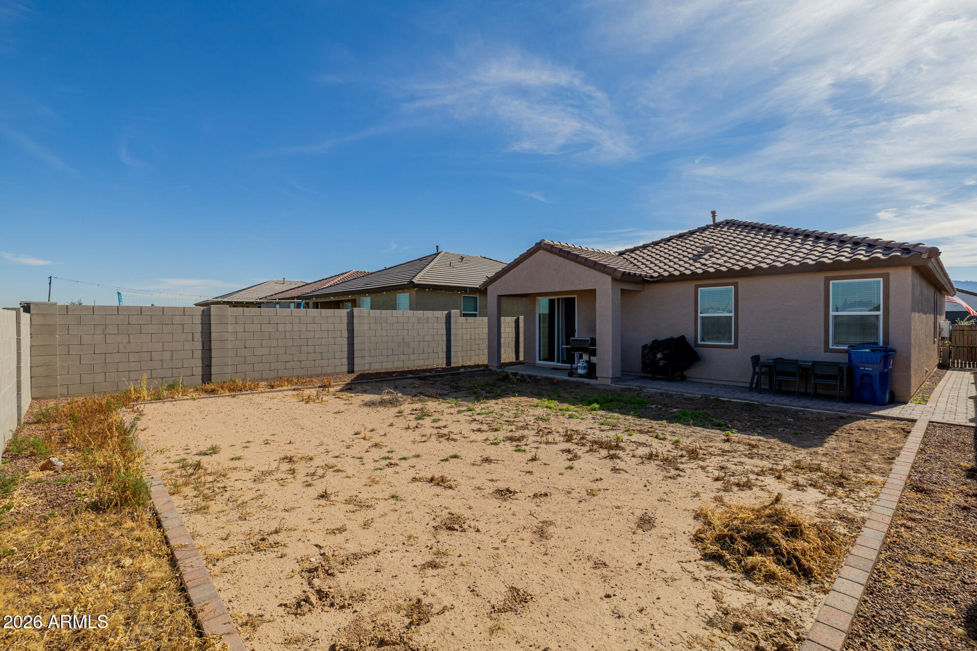 10918 West Atlantis Way Tolleson, AZ 85353 - Photo 20 of 20 a front view of a house with a yard