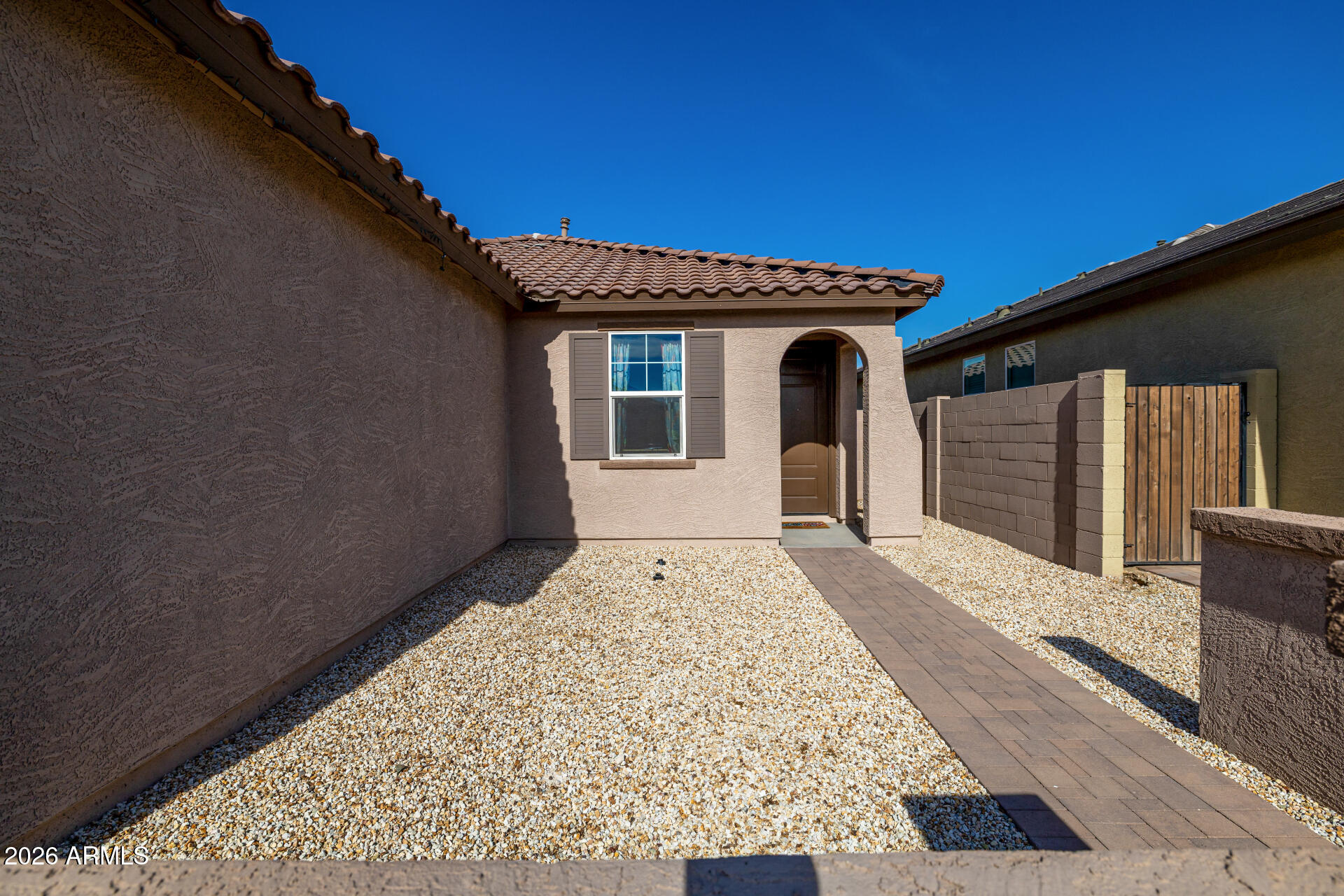 10918 West Atlantis Way Tolleson, AZ 85353 - Photo 3 of 20 a front view of a house with a yard