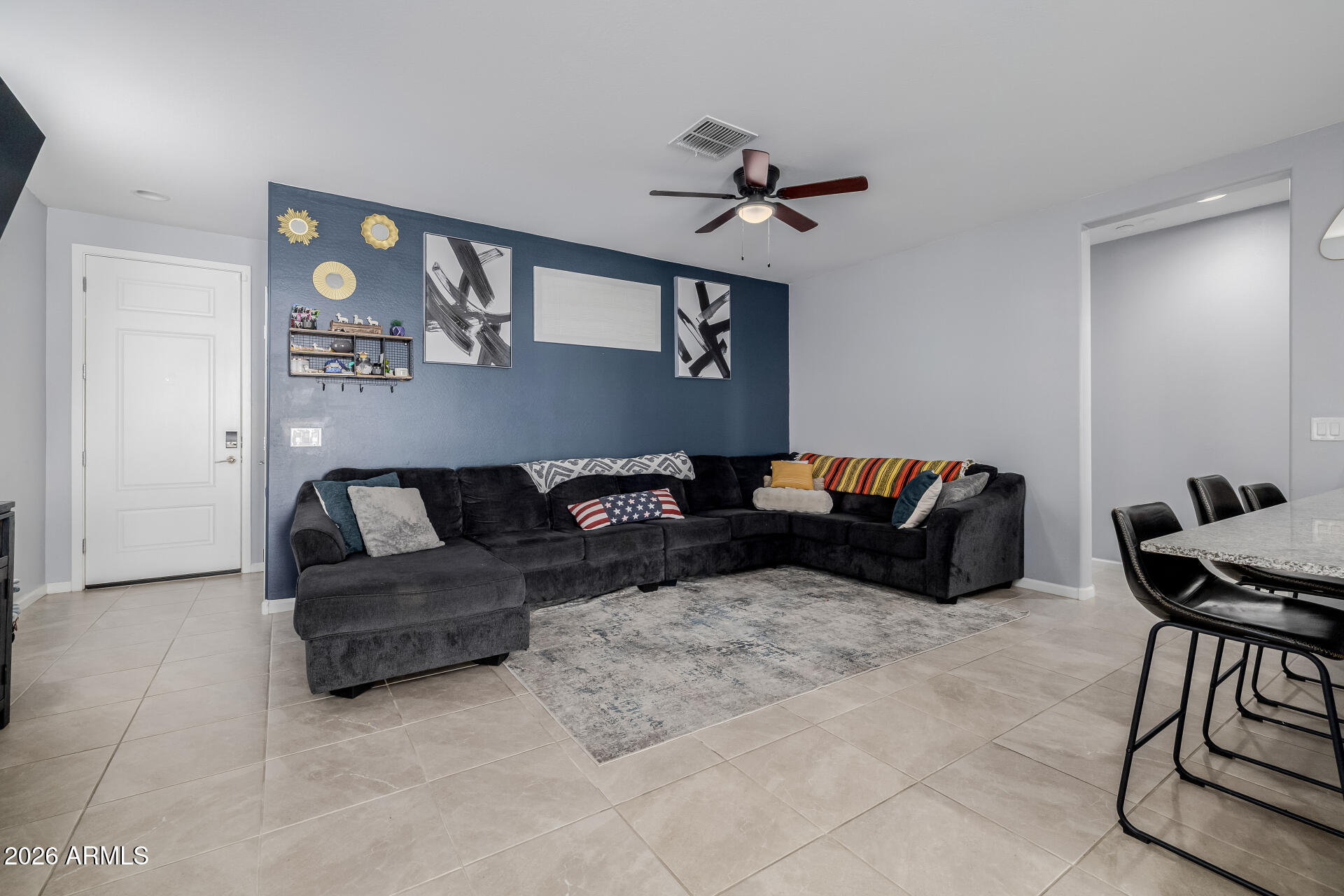 10918 West Atlantis Way Tolleson, AZ 85353 - Photo 5 of 20 a living room with furniture