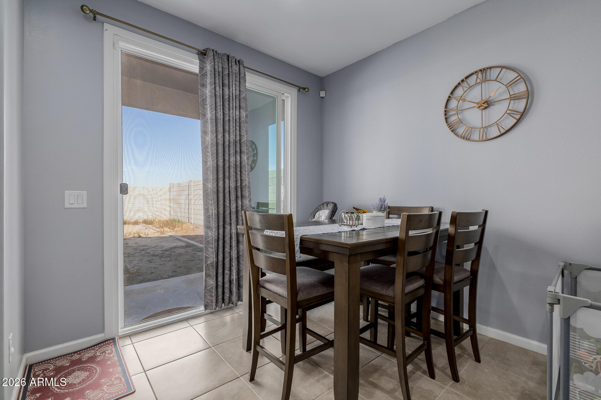 10918 West Atlantis Way Tolleson, AZ 85353 - Photo 8 of 20 a view of a dining room with furniture