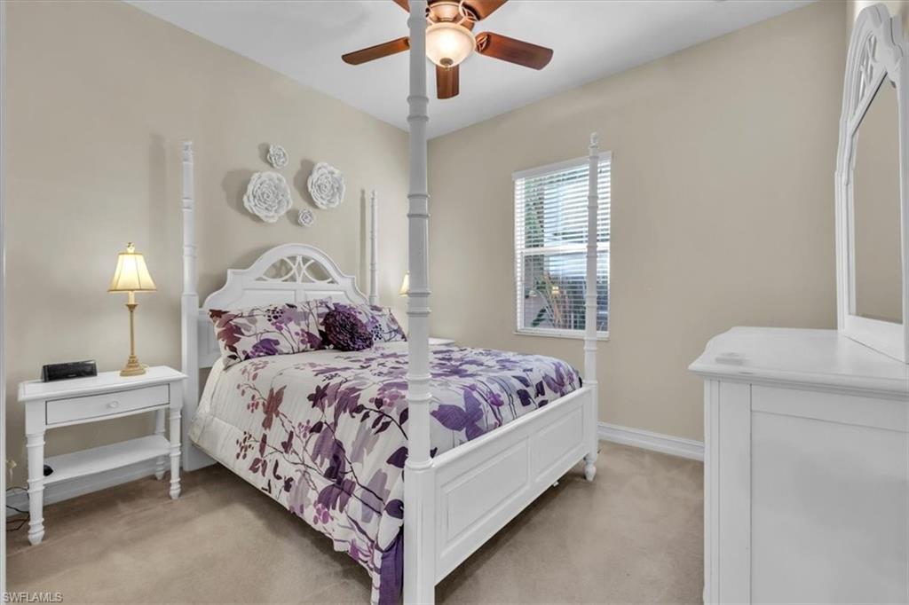 7793 Ashton Road Naples, FL 34113 - Photo 28 of 50 a bedroom with a bed and window