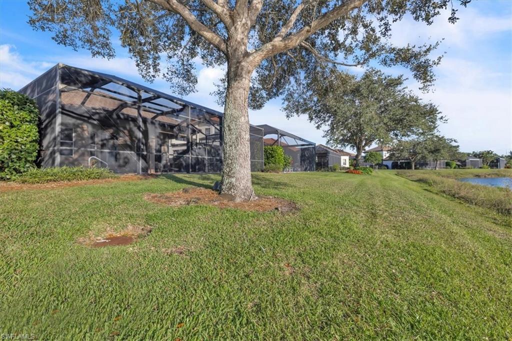 7793 Ashton Road Naples, FL 34113 - Photo 36 of 50 a view of a field with of trees