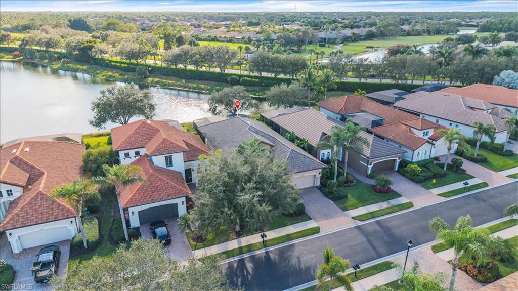 7793 Ashton Road Naples, FL 34113 - Photo 37 of 50 an aerial view of lake residential house with swimming pool and green space